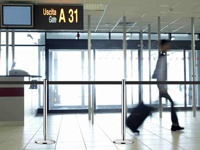 Directing the flow of people at the airport.