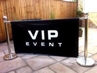 Flat fence with advertising. A poster with the inscription VIP event.