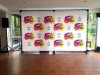 Event walls with posters, music and lighting installation, event host