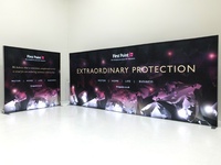 Illuminated advertising wall in two parts, poster printed on textile